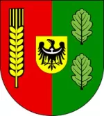 Herb Miękini: tarcza dzielona w słup — po prawej zielone pole z dwoma liśćmi dębu, po lewej purpurowe pole ze złotym kłosem zboża; w centrum złote pole sercowe z czarnym orłem dolnośląskim ze srebrną przepaską na piersi.