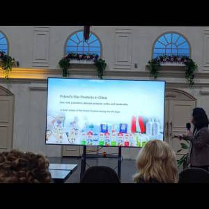 A presentation highlights Poland's products like beer, cosmetics, and vodka at the 4th Expo in China.