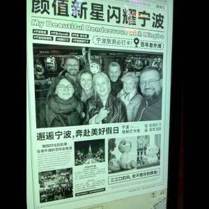 A newspaper feature titled "My Beautiful Rendezvous with Ningbo," showcasing a group of people and local attractions.