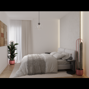 A modern, minimalist bedroom featuring a soft bed, plants, and warm lighting for a cozy atmosphere.