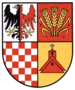 Herb gminy Udanin: tarcza czteropolowa - w lewym górnym czarno-czerwony orzeł ze złotymi szponami i dziobem, w prawym górnym trzy złote kłosy na czerwonym tle, w lewym dolnym szachownica czerwona i srebrna, w prawym dolnym czerwony kościół z krzyżem na żółtym tle.